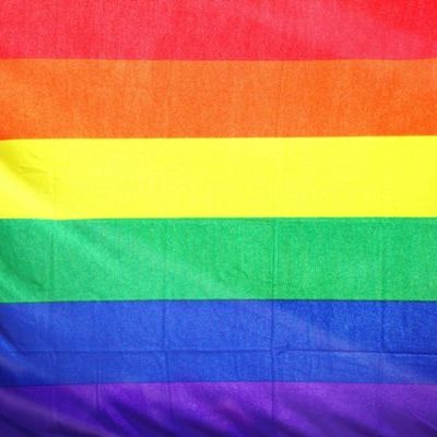 Vibrant rainbow pride flag representing LGBTQ+ community.
